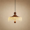 Petite suspension Aubine, chapeau de bois teinté noyer et frange d'acrylique givré, allumée | Delvanie