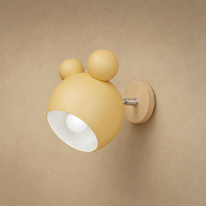 Applique murale Nemuria jaune doux, globe laqué mat et platine en bois clair | Delvanie