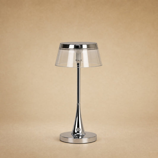 Lampe rechargeable Sévali, abat-jour transparent et couronne chromée, hauteur 27 cm | Delvanie